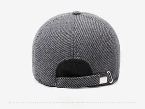 Detail of adjustable metal buckle and warm winter baseball cap back view in grey
