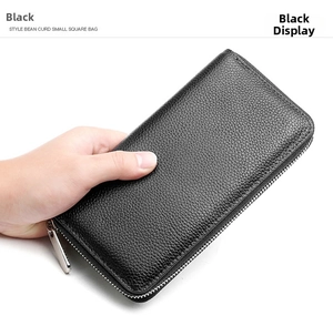 Detailed view of black litchi grain leather wallet with a smooth silver zipper head