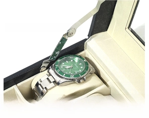 Detail view of the durable alloy hinge on a black leather watch storage box with window