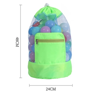 Macro view of large green mesh beach bag showing 48cm height and 24cm base dimensions