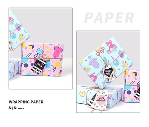 Detailed view of baby shower gift wrap with pastel duck and teddy bear patterns