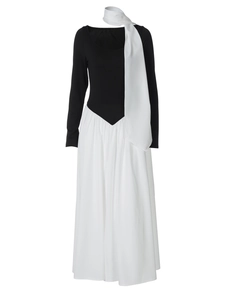 Detail of elegant black and white contrast dress with matching scarf on ghost mannequin