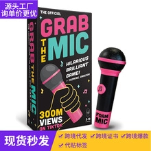 Detail view of the Grab The Mic party game box and black foam microphone prop