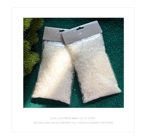 Close-up of artificial white snow powder in clear bags for Christmas tree decoration