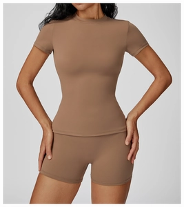 Close-up of mocha brown quick-dry yoga set showing seamless stitching and matte fabric