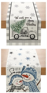 Detail of Christmas table runner with festive truck and snowman illustrations