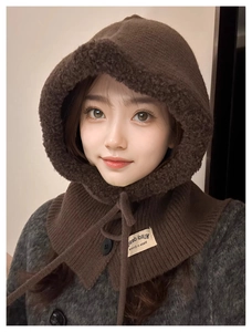 Detail of winter balaclava hood with plush lining, drawstring and decorative button