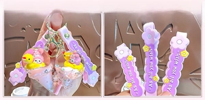 Detail of My Melody liquid sand keychain with purple strap and cute flower charm