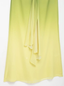 Detail showing the green to yellow ombre gradient on this flowy summer chiffon dress