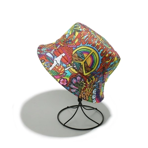 Detail of a graffiti printed bucket hat with hippie flower and mushroom patterns