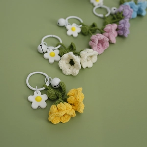 Handmade crochet lily of the valley keychains in yellow, white, pink and purple