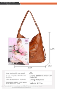 Close-up of brown soft leather shoulder bag with multiple zippers and spacious pockets