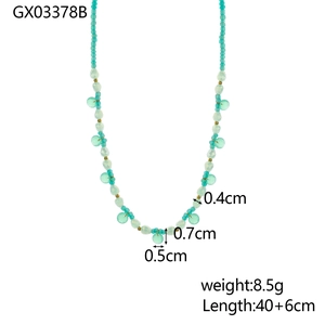 Detail of blue and white beaded necklace showing bead dimensions and gold spacer accents