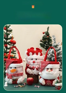 Detailed view of handmade knitted Christmas gift bags with snowman and Santa designs