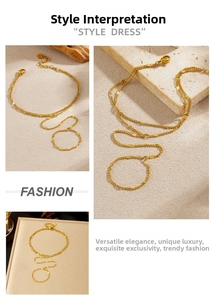 Detail of gold-plated double-layer hand chain with small metal squares and extension