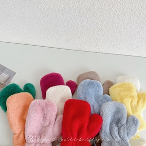 Detailed view of plush kids mittens in multiple candy colors with soft faux fur texture