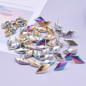 Close-up of diamond-shaped 304 stainless steel earrings in rainbow gold and silver