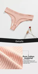 Detailed macro view of peach cotton ribbed thong featuring breathable moisture-wicking fabric