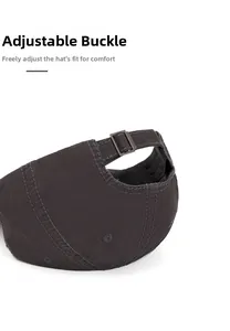 Detail view of adjustable metal buckle on dark grey cotton twill baseball cap