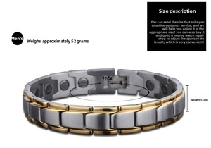 Detail of two-tone stainless steel magnetic therapy bracelet with gold accents