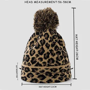 Size chart showing dimensions for leopard print knit beanie with pom pom details