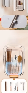 Detail of wall-mounted chopstick organizer showing three-grid magnetic door and drying