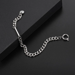 Minimalist silver stainless steel Cuban link bracelet with rectangle bar on dark background