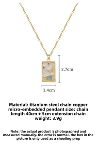 Macro detail of The Moon tarot card pendant in gold finish with star and wave engravings