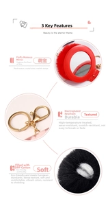 Detail of red faux rabbit fur mirror keychain with golden electroplated clasp