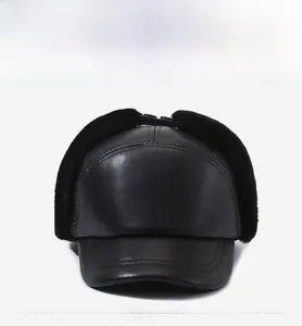 Detail of winter baseball cap for men featuring faux leather and warm black fur earflaps
