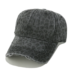 Detailed view of the distressed leopard print charcoal baseball cap with brim fraying
