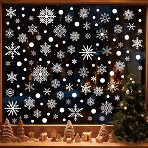 White Christmas snowflake window clings set featuring varied icy crystals and snow dots