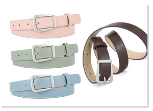 Detail of slim PU leather belts for dresses in pink, green, blue and brown with metal buckles