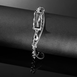 Hip hop silver bracelet with dark rectangular gemstone and layered dual chains design