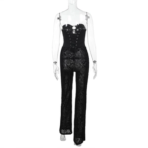 Detailed close-up of black lace-up tube top and sheer lace mesh trousers set on mannequin