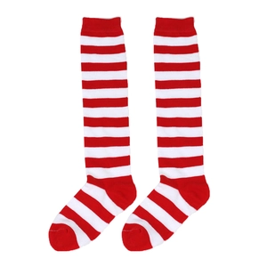 Close-up of red and white striped Christmas knit long socks with detailed fabric texture