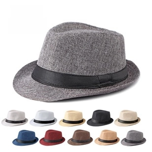 Detail of woven fedora hat texture with black ribbon and multi-color selection grid