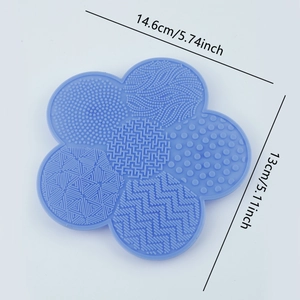 Detailed view of blue flower silicone makeup brush cleaning mat with size dimensions