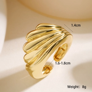 Macro shot showing wavy gold-plated geometric ring details with 1.4cm width and smooth finish