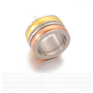 Macro detail of 13mm wide stainless steel tri-color ring with inlaid zircon stones