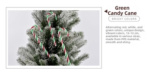 Detail view of red white and green striped candy cane ornaments on a snowy Christmas tree