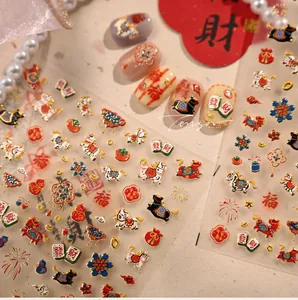 Detailed 3D nail art stickers featuring Chinese New Year motifs like mahjong and fortune horses