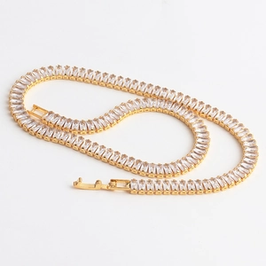 Detail of a gold plated zircon tennis bracelet with rectangular crystals and secure clasp