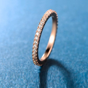 Elegant rose gold eternity ring featuring a full circle of shimmering zircon stones