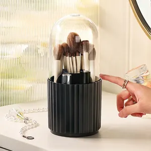 Rotating makeup brush holder with black striped base and clear dustproof cover