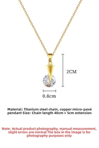 Detailed close-up of a V-shaped zircon pendant on a gold-plated stainless steel chain