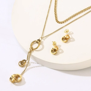 Detail of 18K gold-plated double-layer necklace and interlocking hoop earrings set
