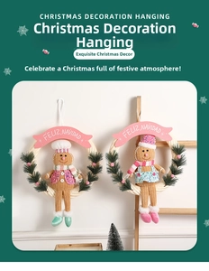 Detail of Christmas gingerbread man wreath ornaments with pine needles and festive ribbons