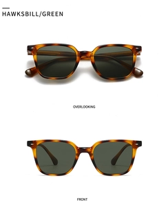 Detail of vintage tortoise square sunglasses with green lenses and star rivets