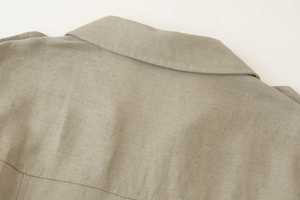 Detail shot of the back neckline on a light gray linen blend sleeveless maxi dress